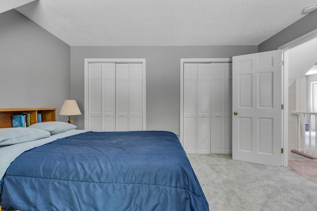35 Whitethorn Dr, Guilford, CT 06437 - bedroom with carpet, a textured ceiling, and multiple closets