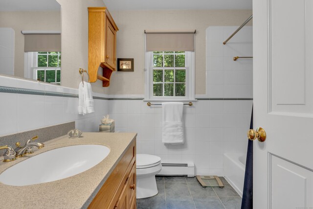 35 Whitethorn Dr, Guilford, CT 06437 - full bathroom featuring baseboard heating, tile patterned floors, toilet, tile walls, and healthy amount of natural light