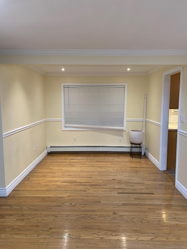 92 Jones Dr, New Britain, CT 06053 - empty room with crown molding, wood-type flooring, recessed lighting, baseboards, and a baseboard heating unit