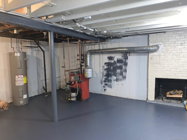 92 Jones Dr, New Britain, CT 06053 - unfinished below grade area with electric water heater, a heating unit, and a brick fireplace