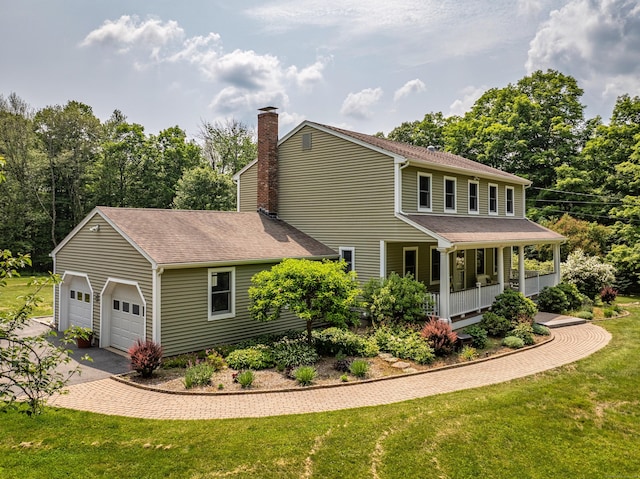 47 Davis Rd, Mansfield, CT 06268 - view of side of home featuring covered porch, a lawn, an attached garage, and a shingled roof