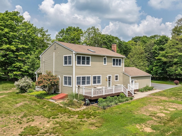 47 Davis Rd, Mansfield, CT 06268 - back of property with a chimney, a deck, a yard, and roof with shingles