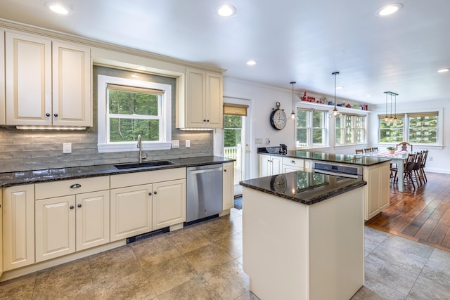 47 Davis Rd, Mansfield, CT 06268 - kitchen with appliances with stainless steel finishes, a kitchen island, backsplash, recessed lighting, and hanging light fixtures
