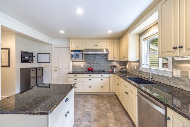 47 Davis Rd, Mansfield, CT 06268 - kitchen with stainless steel appliances, cream cabinetry, under cabinet range hood, tasteful backsplash, and dark stone countertops