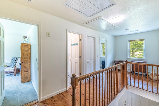 47 Davis Rd, Mansfield, CT 06268 - hall with attic access, an upstairs landing, and wood finished floors