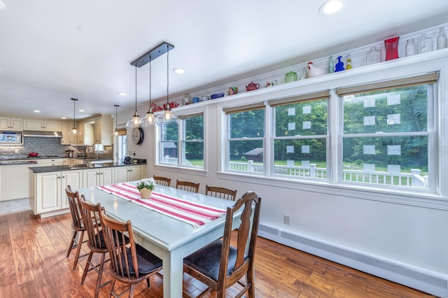 47 Davis Rd, Mansfield, CT 06268 - dining room featuring a baseboard radiator, wood-type flooring, and recessed lighting