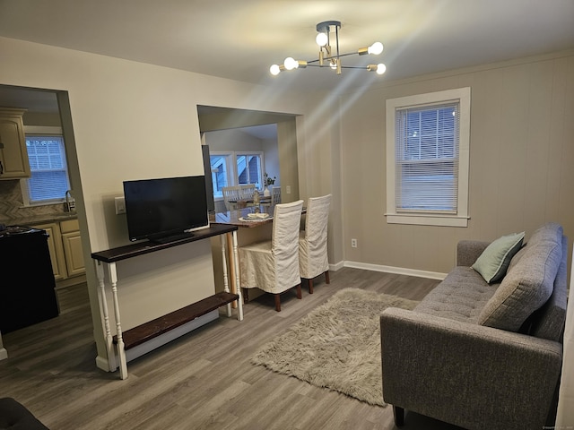 262 Meyer Rd, Torrington, CT 06790 - living area with a chandelier and wood finished floors