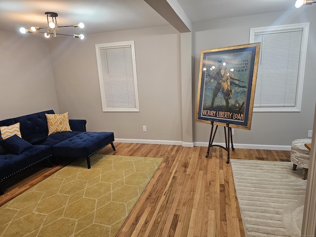 262 Meyer Rd, Torrington, CT 06790 - living area featuring wood finished floors and a chandelier