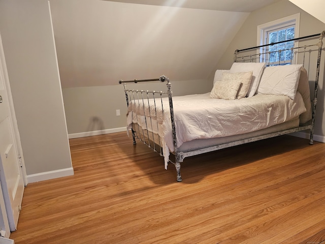 262 Meyer Rd, Torrington, CT 06790 - bedroom with lofted ceiling and light wood-style floors