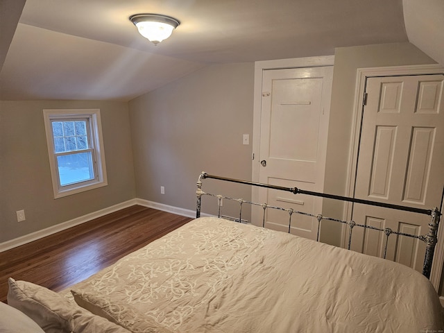 262 Meyer Rd, Torrington, CT 06790 - bedroom with lofted ceiling and dark wood-style floors