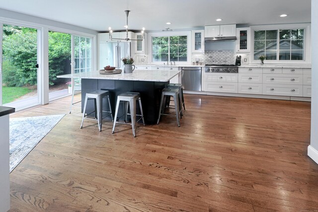 29 Bayberry Rd, Fairfield, CT 06825 - kitchen featuring appliances with stainless steel finishes, healthy amount of natural light, white cabinetry, and recessed lighting