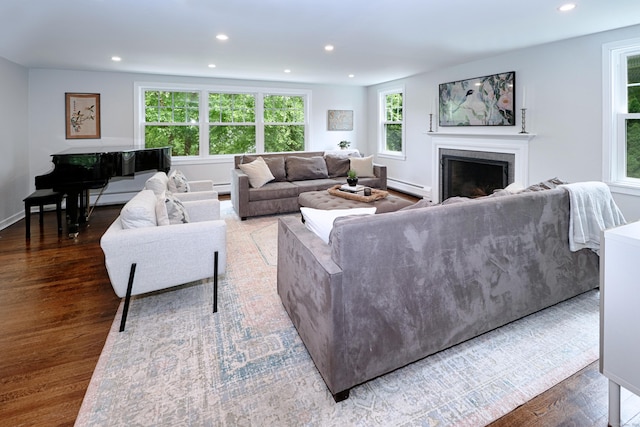 29 Bayberry Rd, Fairfield, CT 06825 - living room with a fireplace, wood finished floors, recessed lighting, and a baseboard heating unit