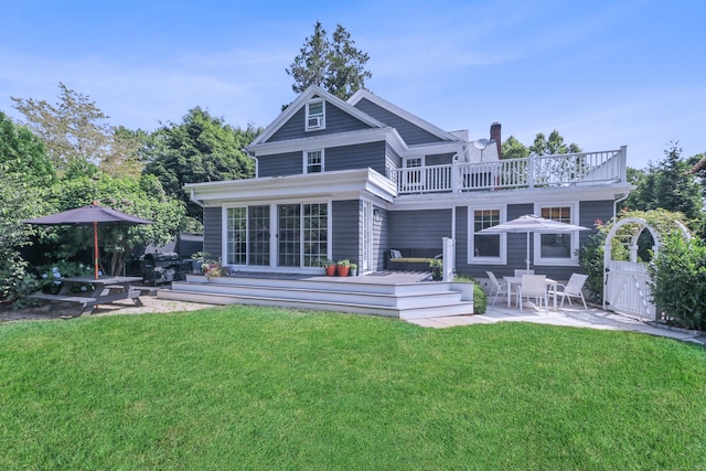 29 Bayberry Rd, Fairfield, CT 06825 - back of property featuring a balcony, a patio, a lawn, and a deck