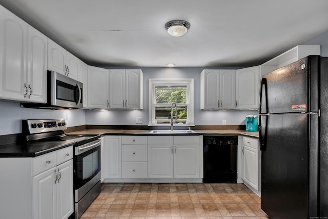 824 Torringford W St, Torrington, CT 06790 - kitchen featuring black appliances, dark countertops, and white cabinets