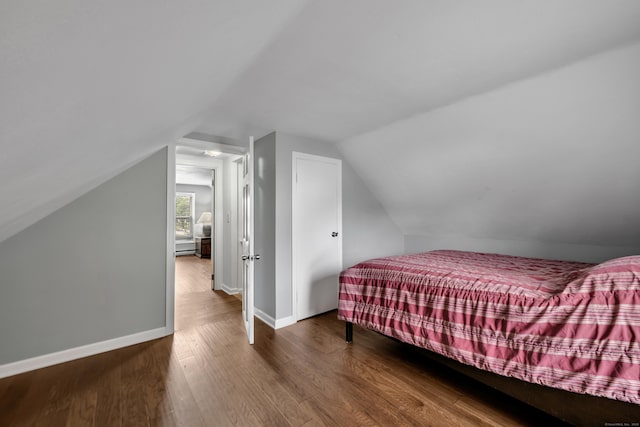 824 Torringford W St, Torrington, CT 06790 - bedroom with wood finished floors, lofted ceiling, and a baseboard radiator