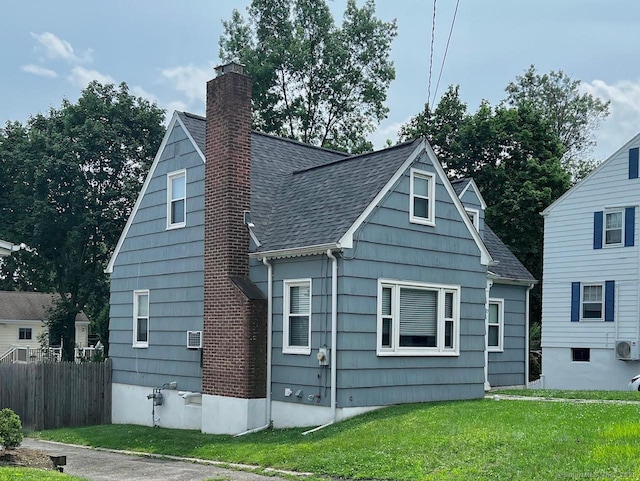 17 Rock Spring Rd, Stamford, CT 06906 - view of side of home with a chimney and roof with shingles