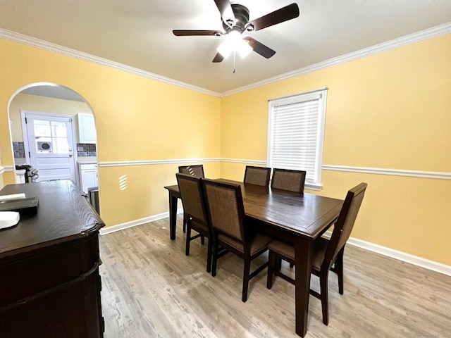 17 Rock Spring Rd, Stamford, CT 06906 - dining room with crown molding, ceiling fan, light wood-type flooring, and arched walkways
