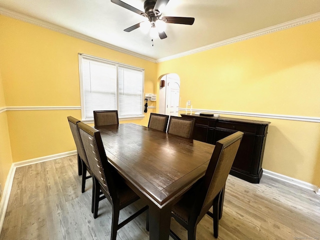 17 Rock Spring Rd, Stamford, CT 06906 - dining area featuring arched walkways, ceiling fan, crown molding, and light wood-style floors