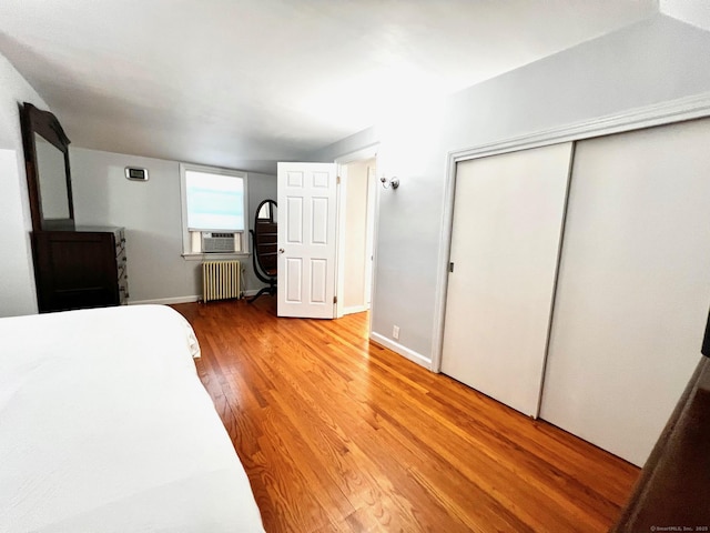 17 Rock Spring Rd, Stamford, CT 06906 - bedroom featuring radiator heating unit, light wood-style flooring, a closet, and cooling unit