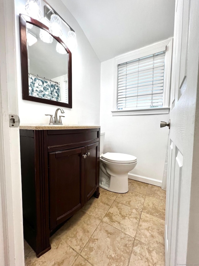 17 Rock Spring Rd, Stamford, CT 06906 - bathroom featuring vanity, lofted ceiling, and tile patterned flooring