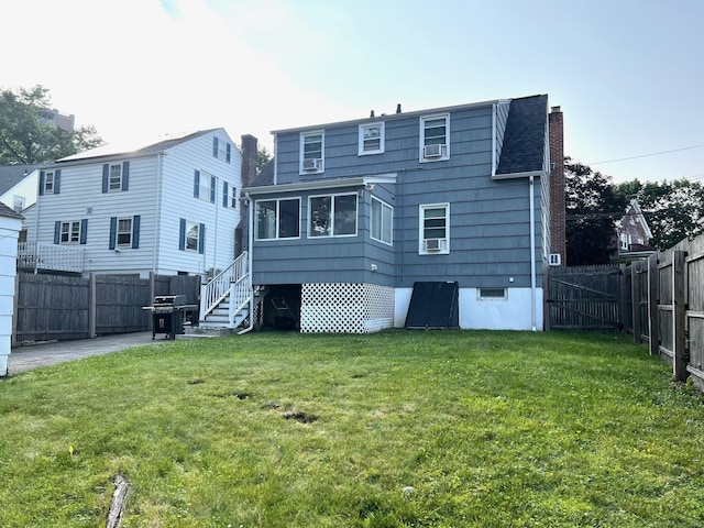 17 Rock Spring Rd, Stamford, CT 06906 - back of property with a fenced backyard, cooling unit, and a chimney