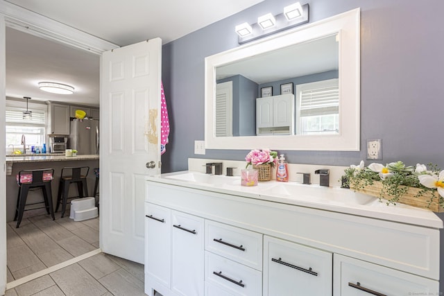 12 John St, Killingly, CT 06239 - bathroom featuring double vanity and wood tiled floors