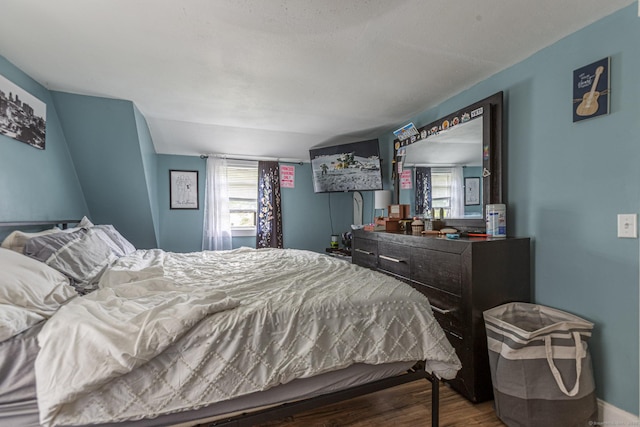 12 John St, Killingly, CT 06239 - bedroom with multiple windows, wood finished floors, and baseboards