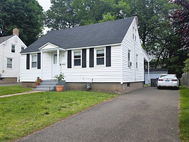 149 Branford St, Manchester, CT 06040 - view of front of house featuring roof with shingles, a chimney, and a front lawn