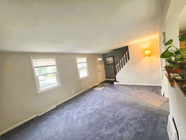 149 Branford St, Manchester, CT 06040 - unfurnished living room with stairs, carpet flooring, and baseboards