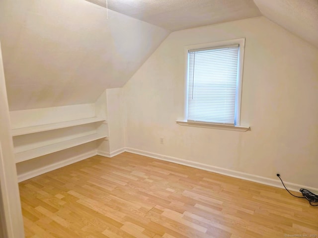 149 Branford St, Manchester, CT 06040 - bonus room featuring wood finished floors, vaulted ceiling, and baseboards