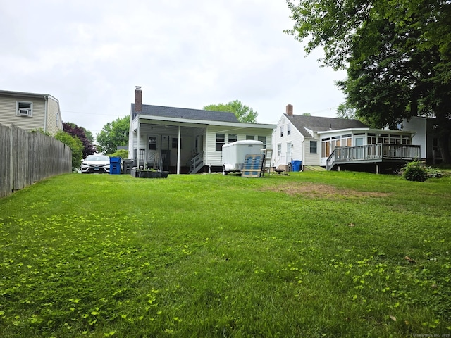 149 Branford St, Manchester, CT 06040 - rear view of property with a chimney and a deck
