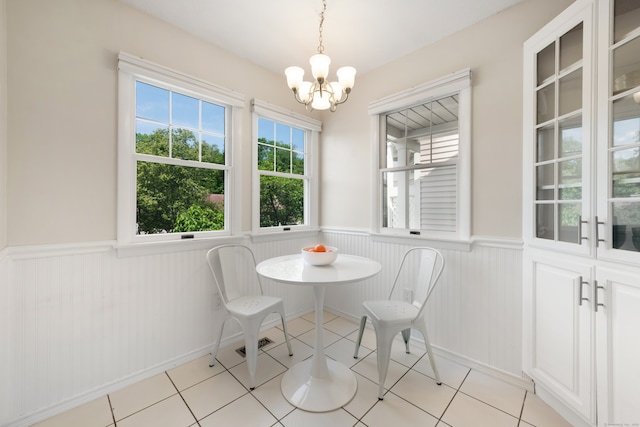 75 Brittania Rd Unit 75, Danbury, CT 06811 - dining room featuring a wainscoted wall, a chandelier, and light tile patterned floors