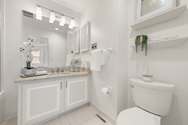 75 Brittania Rd Unit 75, Danbury, CT 06811 - bathroom with toilet, tile patterned flooring, vanity, and baseboards