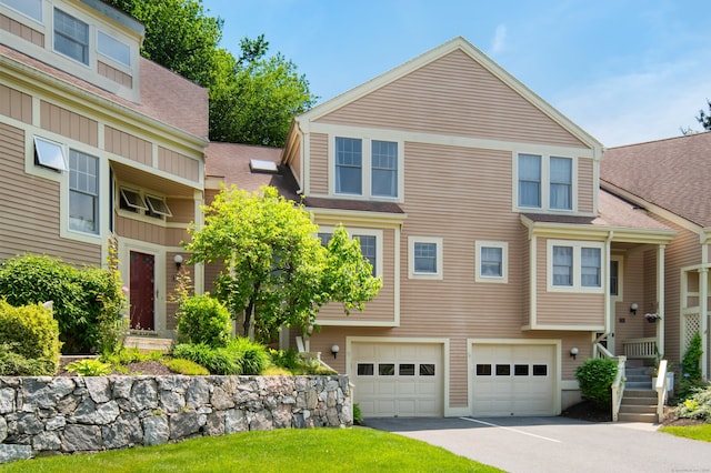 75 Brittania Rd Unit 75, Danbury, CT 06811 - view of front of property featuring a garage, asphalt driveway, and a shingled roof