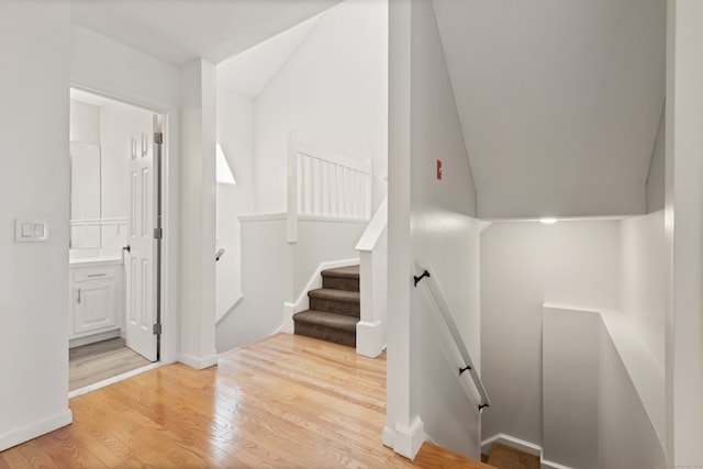 75 Brittania Rd Unit 75, Danbury, CT 06811 - staircase with wood finished floors, vaulted ceiling, and baseboards