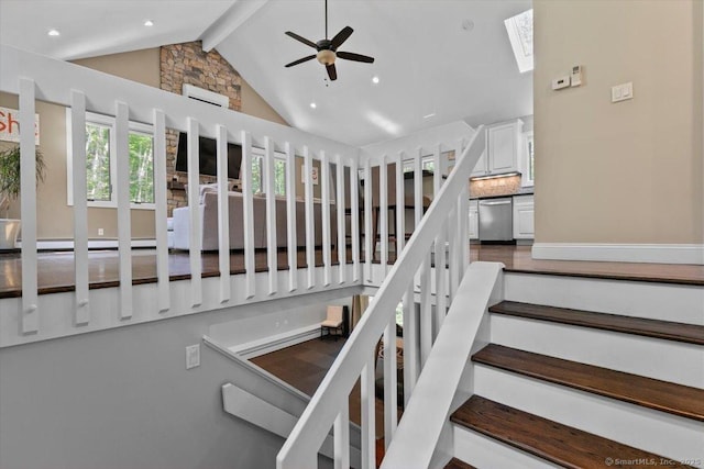 2 Round Hill Rd, Shelton, CT 06484 - stairs with beam ceiling, a skylight, ceiling fan, high vaulted ceiling, and an AC wall unit
