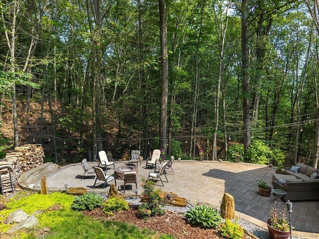 2 Round Hill Rd, Shelton, CT 06484 - view of patio / terrace featuring a fire pit and a view of trees