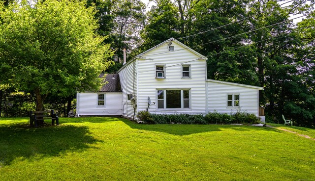 126 Christain Hill Rd, Dover, NY 12522 - back of property with a lawn and view of scattered trees