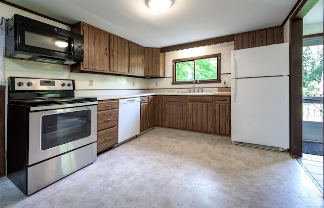 126 Christain Hill Rd, Dover, NY 12522 - kitchen with white appliances, light countertops, and brown cabinets