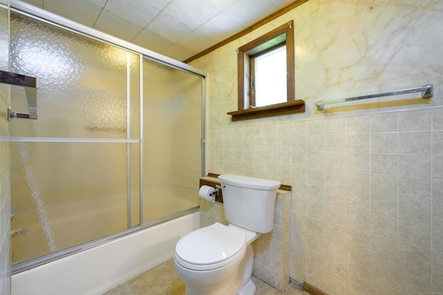 126 Christain Hill Rd, Dover, NY 12522 - bathroom featuring bath / shower combo with glass door, tile walls, tile patterned flooring, and a wainscoted wall