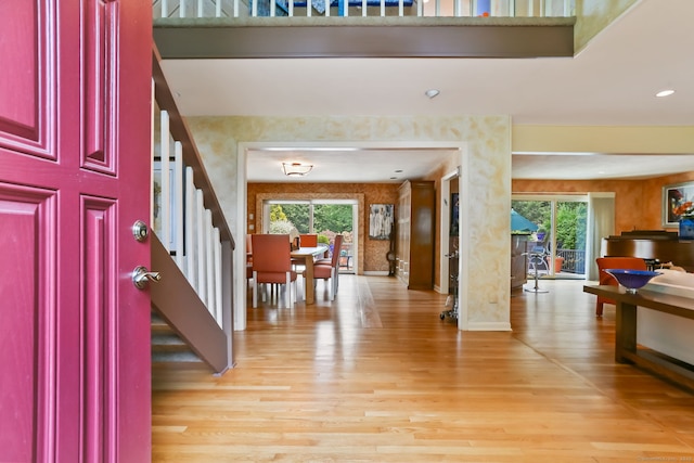 8 Hedgerow Cmn, Weston, CT 06883 - entrance foyer featuring healthy amount of natural light, stairway, and light wood-style flooring