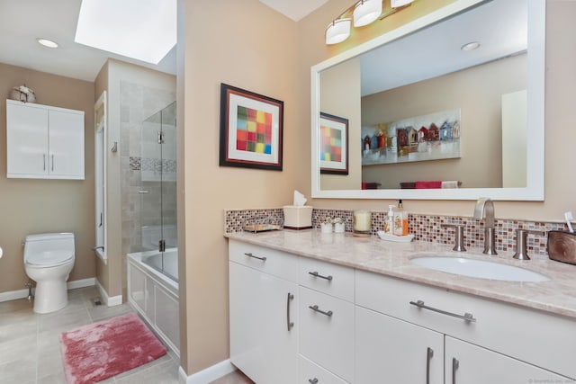 8 Hedgerow Cmn, Weston, CT 06883 - full bathroom featuring toilet, vanity, tile patterned flooring, baseboards, and combined bath / shower with glass door