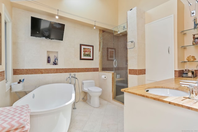 8 Hedgerow Cmn, Weston, CT 06883 - full bath with a stall shower, vanity, a freestanding bath, tile walls, and toilet