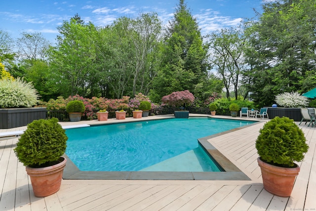 8 Hedgerow Cmn, Weston, CT 06883 - swimming pool with a wooden deck and view of wooded area