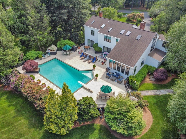 8 Hedgerow Cmn, Weston, CT 06883 - swimming pool featuring outdoor dining space, a deck, an outdoor living space, a diving board, and a patio