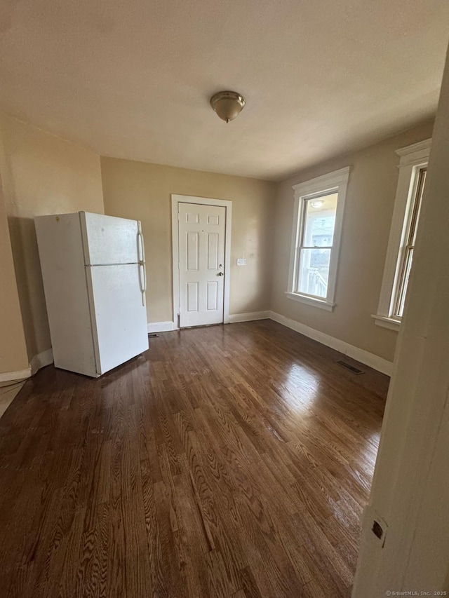 49 Dover St, Bridgeport, CT 06610 - empty room featuring dark wood finished floors