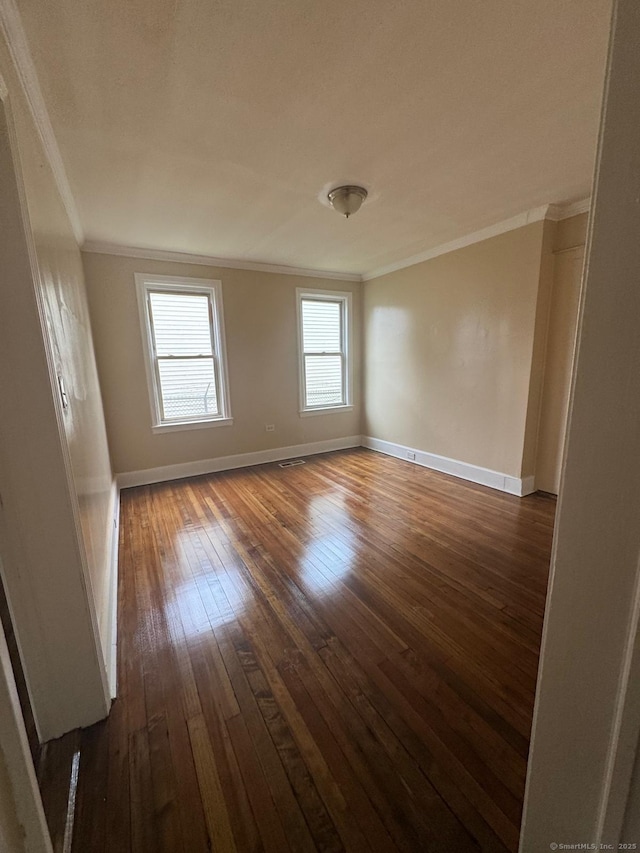 49 Dover St, Bridgeport, CT 06610 - empty room with crown molding and dark wood-style flooring