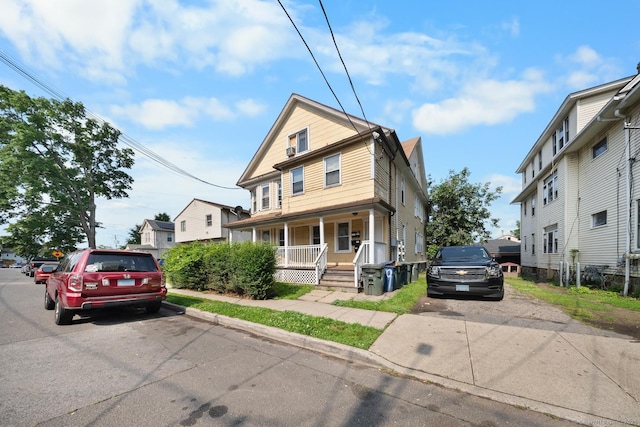 49 Dover St, Bridgeport, CT 06610 - american foursquare style home with a porch and a residential view