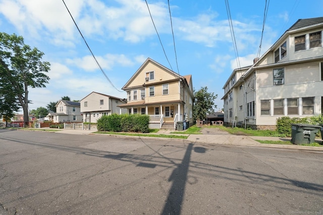 49 Dover St, Bridgeport, CT 06610 - view of front of home featuring a residential view, a porch, and cooling unit