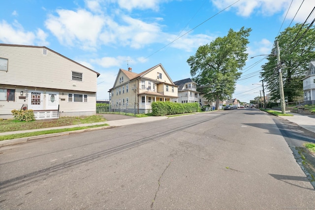 49 Dover St, Bridgeport, CT 06610 - view of asphalt road featuring sidewalks, street lights, curbs, and a residential view